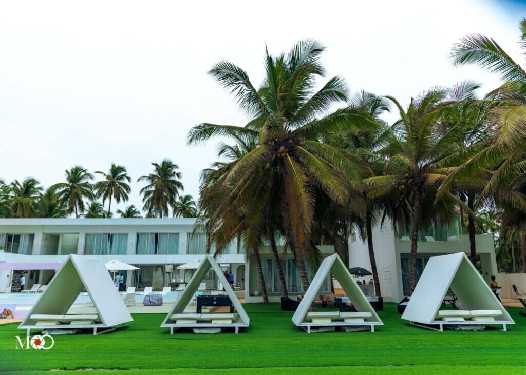 Beach party in Lagos Ilashe with guests enjoying music, food and ocean view